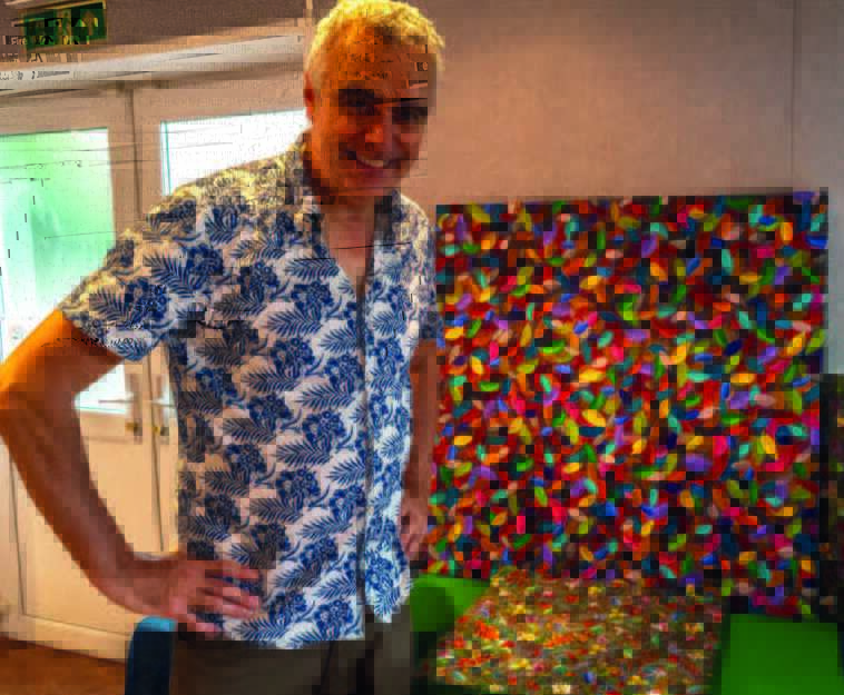 Mike Cahillane with some of his paintings
